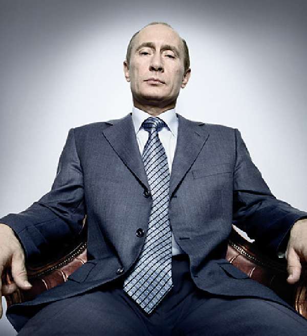 photograph of Putin sitting in a chair